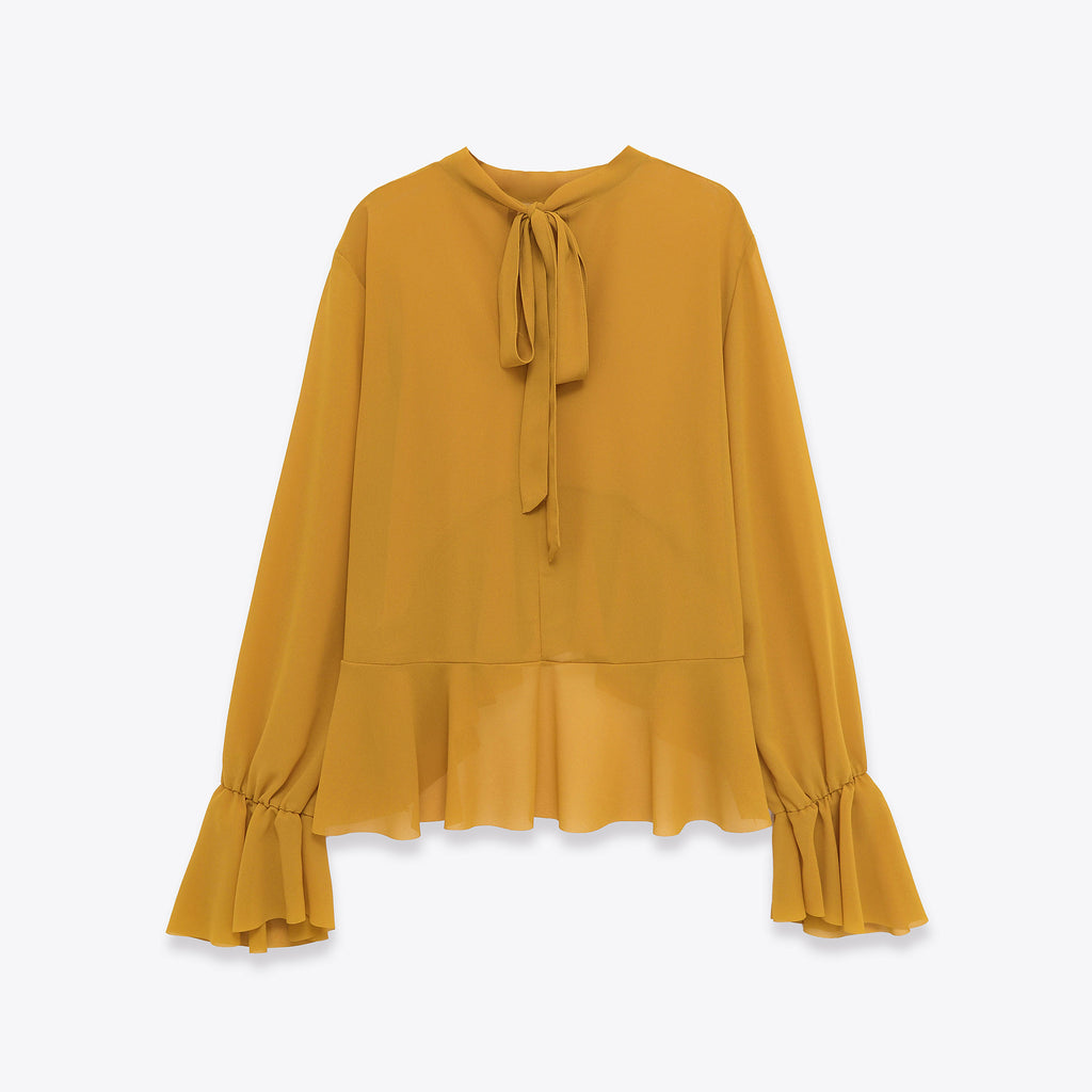 Elegant Chiffon Top With A Flowing Ruffled Hem